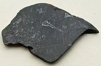 A drak grey slab with white outlines