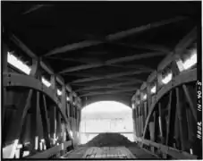View from inside bridge, looking Southeast, showing upper wind bracing and ties, double Burr Arch rings, and truss framing
