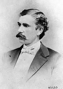 1870 black and white head and shoulders left profile photo of US Army officer George H. Burton in suit and tie