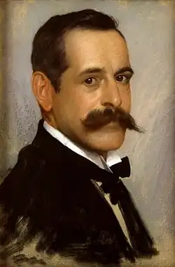 A profile view of a young man with his head turned to face the viewer. He is wearing a blazer and bow tie and has short cropped hair and a moustache. It is a colour oil painting.