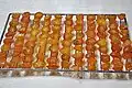 Drying geumgyul-jeonggwa (candied kumquat) on a drying rack