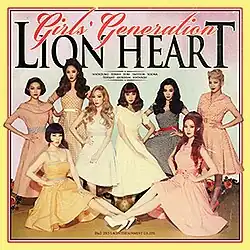 The album cover is surrounded by orange and yellow borders, with the group's name and the album title cover appearing above them colored in orange and black, respectively. The band members are clothed in 1950s style dresses.