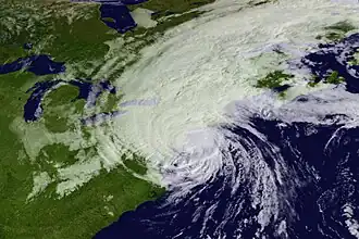 Gloria is shown as a large hurricane as it is making landfall in new England. The storm is in the process of losing its tropical characteristics; its eye has become obscured, and the vast majority of convection is located along the left half of the circulation.