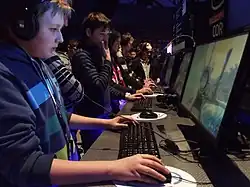 Casual players playing a shooter at the 2013 Intel Extreme Masters in Katowice, Poland