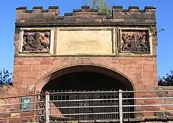 An 18th-century plaque on the Goblin Tower, marking the repairs to the city walls following heavy damage during the civil war.