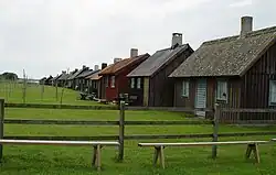 Area for drying nets behind one of the rows of cottages