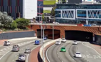 A dual carriageway road entering a tunnel
