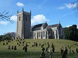 A stone church with a Gothic tower