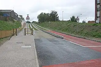 Modal junction of concrete rollway and tarmac highway