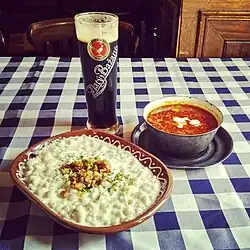 Image 34Halušky with bryndza cheese, kapustnica soup and Zlatý Bažant dark beer—examples of Slovak cuisine (from Culture of Slovakia)