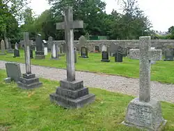 The three cross shaped gravestones of the Clare family at Bretherton Church