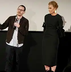 Aster and Collette standing onstage