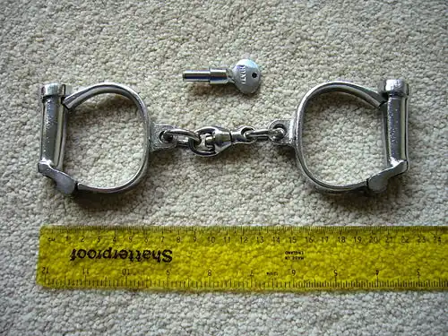 Hiatt type 104 "Darby" handcuffs and key.  1950s