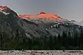 Alpenglow on west aspect of Icy Peak, as seen from Nooksack Cirque at sunset