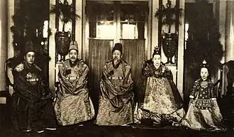Gojong (center) and his family, photo taken in the central lobby of the main building (1918)[3][38]