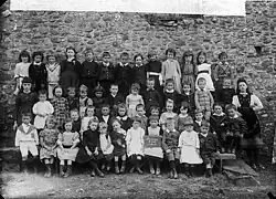 Group of children seated in rows