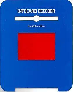 A blue piece of cardboard with a red film square