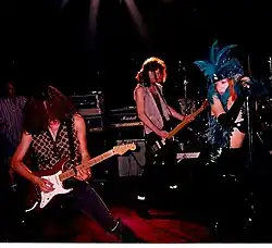 Lorre (right) performing in 1990