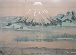 Landscape dominated by a high mountain crowned with snow.