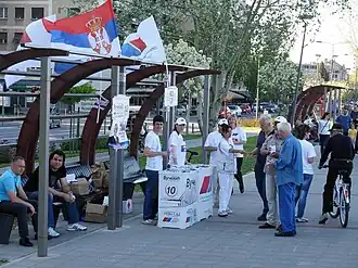Members of the Serbian Progressive Party handing leaflets in Novi Sad in April 2012