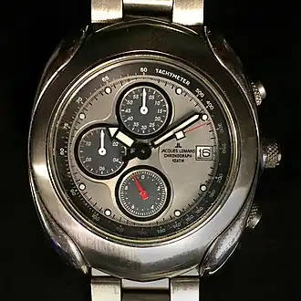 Chronograph with quartz movement and battery. The small red hand makes one revolution per second, enabling a relatively high precision for time stopping operations.