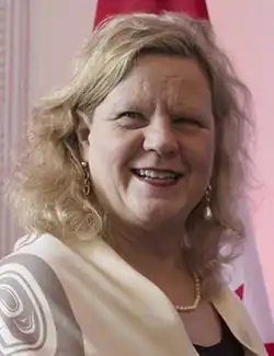 Photograph of Charette smiling.