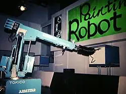 Robotic arm painting a picture.