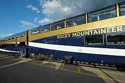 Train rounding a curve next to a river