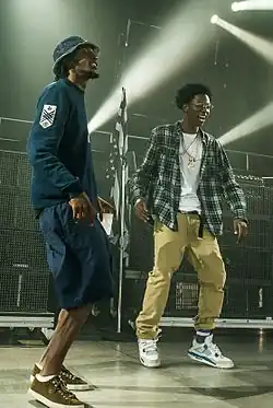 CJ Fly (left) with Joey Badass at the Under the Influence Tour in Toronto, Canada in August 2013