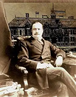 Photo of Don Carlos Young Sitting in chair