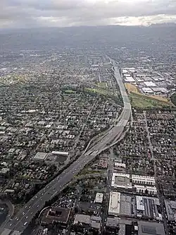 Aerial view of I-280 in San Jose, looking northeast toward the Joe Colla Interchange (I-680/US&nbsp;101) in the distance