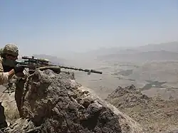 KCT sniper with an Accuracy International Arctic Warfare rifle during a mission in southern Afghanistan.