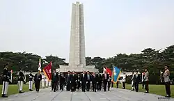 Prime Minister John Key and New Zealand veterans of the Korean War visit the National Cemetery of Korea. 2013
