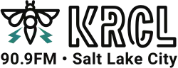 In the upper left corner, a black illustration of a bee with two teal-colored thunderbolts emerging from its wings. To the right, the letters KRCL in a sans serif in a treatment suggesting neon light tubes. Below are the words "90.9FM" and "Salt Lake City" in a sans serif in black.