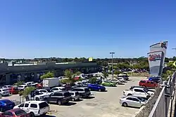 Shopping centre and car park viewed from an elevated position