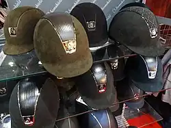 Equestrian helmet covered with shiny lines.