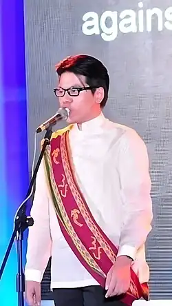 Keb Cuevas speaks at Enactus Philippines wearing the UP Sablay