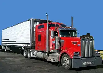 Class 8 Kenworth W900 tractor with spread-axle 48-foot (14.63&nbsp;m) refrigerated trailer.