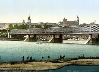 Kierbedź Bridge over the Vistula in Warsaw (c.&nbsp;1900). This framework bridge was constructed by Stanisław Kierbedź in 1850–1864. It was destroyed by the Germans in 1944.[42]