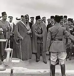 Image 15Abdulaziz (left) and Farouk checking an Egyptian Army unit in 1946. Other people picture include princes Fahd, Abdullah, and Mishaal, as well as prince Muhammad Abdel Moneim. (from History of Saudi Arabia)