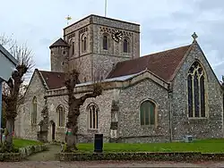 The Church of England parish church of St. Mary's in Kingsclere, Hampshire, England - viewed from the south east. December 2024.
