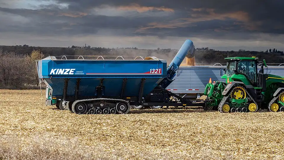 Kinze Grain Cart loading grain in field