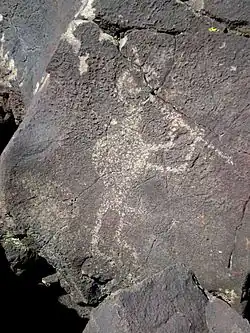 Kokopelli petroglyph, BLM land near Embudo, New Mexico.