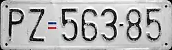 Example of a Yugoslav-era format license plate from Prizren, issued between 1998 and 30 September 1999, with a Yugoslav flag separator offset.