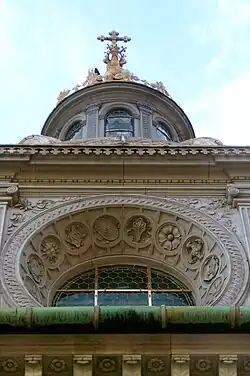 Window decoration and a spire sit atop the dome