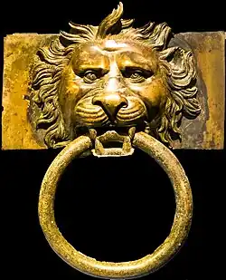 Lion protome with a square cross-section. These were set at the ends of two wooden beams in one of the ships' transverse axes as extensions for platforms on each side of the ship that primarily served as landing stages. Their rings were probably used to secure the ship to the dock