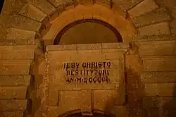 Inscription on the front side of the Laferla Cross shrine.