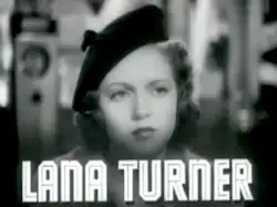 Woman staring in distance, the words "Lana Turner" beneath her