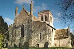 West view of church showing Early English lancet windows and tall 16th-century pinnacles