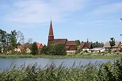 Panorama of Leśno with the historic church of the Exaltation of the Holy Cross